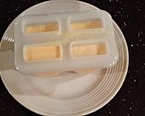 A picture of step 2 of Orange Cream Popsicles.