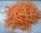 A picture of step 1 of Sunomono-Style Carrot, Cucumber, and Egg Salad.