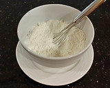A picture of step 2 of Cherry Thumbprint Cookies.
