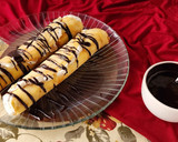 Foto del paso 7 de la receta: 🫔Panqueques rellenos de manzana, pasas y crema, bañados con salsa de chocolate🫔 Canelones dulces