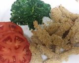 A picture of step 10 of Turkey Cutlets with sautéed spinach and tomato slices.