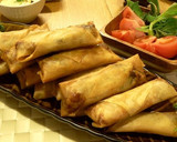 A picture of step 6 of Authentic Spring Rolls with lots of Veggies.
