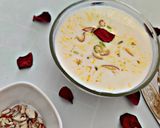 A picture of step 13 of Turiya patra with poori and basundi.