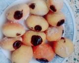 A picture of step 10 of The Happiness with Chocolate filled mini donuts.