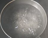 A picture of step 1 of Penne pasta in white sauce (with fresh cream and cheese).