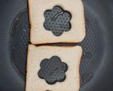 A picture of step 4 of Savoury Rosemary Flower Egg in a Hole.