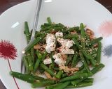 A picture of step 4 of French beans tossed with nuts and feta cheese salad.