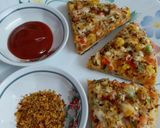 A picture of step 11 of Cheesy Mexican Veg Pizza.
