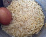 A picture of step 1 of Indomie Noodles with Fried Eggs #noodlesrecipecontest.