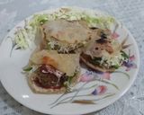 A picture of step 6 of Pita bread with falafel and tahini sauce.