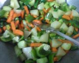 A picture of step 3 of Rosgolla naboratan korma.