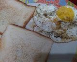 A picture of step 3 of Half fry Egg with toast.