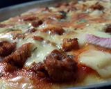 A picture of step 6 of chicken tikka pizza.