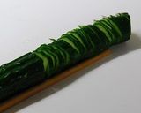 A picture of step 3 of Accordion Cucumbers.