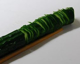 A picture of step 3 of Accordion Cucumbers.