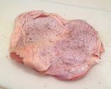 A picture of step 1 of Authentic Garlic Chicken in a Frying Pan.