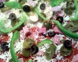 A picture of step 7 of sunshine pizza pie.