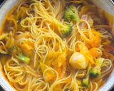 A picture of step 6 of Seafood Tomato Pasta Soup.