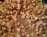 A picture of step 2 of Golden ramen potatoes and peas.