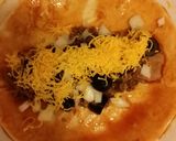A picture of step 10 of Taisen's beef and bean enchiladas.