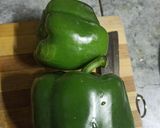 A picture of step 1 of Capsicum Pyaaz Ki Sabzi.