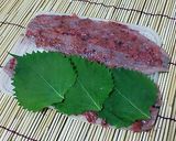 A picture of step 2 of Fried Seasonal Pacific Saury with Shiso and Plum.