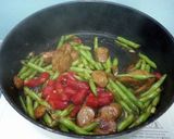 A picture of step 3 of Green Bean And Sausage In BBQ Sauce.
