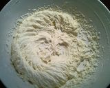 A picture of step 3 of Raspberry Almond Thumbprint Cookies.
