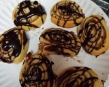 A picture of step 5 of Cinnamon Sugar Cresent Pinwheels with chocolate drizzle.