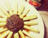 A picture of step 4 of Yam fries with onion sauce.