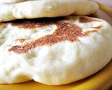A picture of step 9 of Light and Puffy Homemade Naan Bread in a Pan.