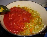 A picture of step 3 of Simple Butter Chicken Curry using a Hand Blender.