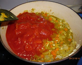 A picture of step 3 of Simple Butter Chicken Curry using a Hand Blender.
