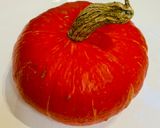 A picture of step 1 of Pumpkin in the oven with tomatoes.