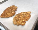 A picture of step 2 of Chicken Parmesan.