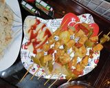 A picture of step 3 of Chinese with shashlic sticks.
