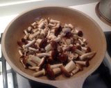 A picture of step 4 of Spaghetti with Rabbit Ragù, Mushrooms, and Walnuts.