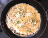 A picture of step 2 of Sweet Maska Bun with omelette and tea.