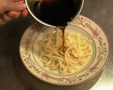 A picture of step 5 of Caesar Salad Udon.