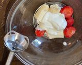 A picture of step 3 of Strawberry banana smoothie using a hand blender.