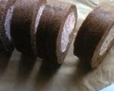A picture of step 12 of Chocolate Roll Cake with Pink Raspberry Cream.