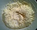 A picture of step 4 of Raspberry Almond Thumbprint Cookies.