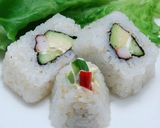 A picture of step 11 of Inside-Out Uramaki California Rolls.