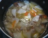 A picture of step 4 of Hearty and Creamy Tonjiru (miso soup with pork, vegetables and a dash of milk).