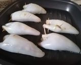 Foto del passaggio 6 della ricetta Calamari ripieni di melanzane su letto di pomodorini