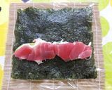 A picture of step 5 of California Roll with Raw Tuna.