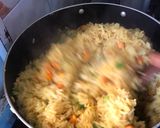 A picture of step 3 of Fried rice n plantain with chicken sauce garnished with kale leaf.