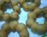 A picture of step 3 of Plain or Chocolate Pon-De-Ring Style Donuts.