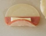 A picture of step 3 of Pan-fried Gyoza with Rolled Ham and Cheese.