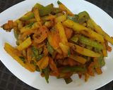 A picture of step 5 of Potato Capsicum fry.
